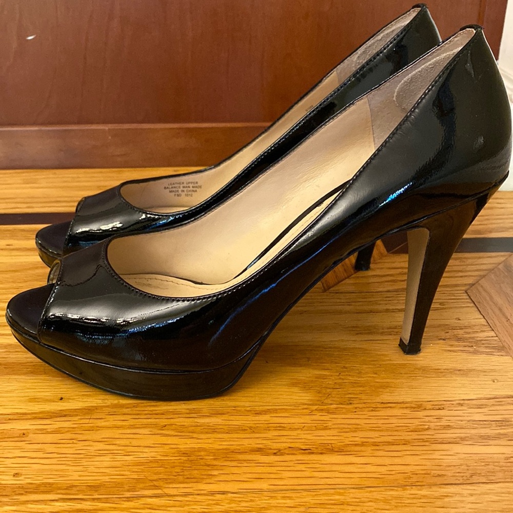 Size 9.5 Enzo Angiolini Black Patent leather stiletto platform heels.